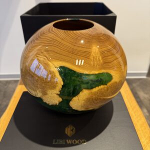 Wooden bowl with emerald green resin
